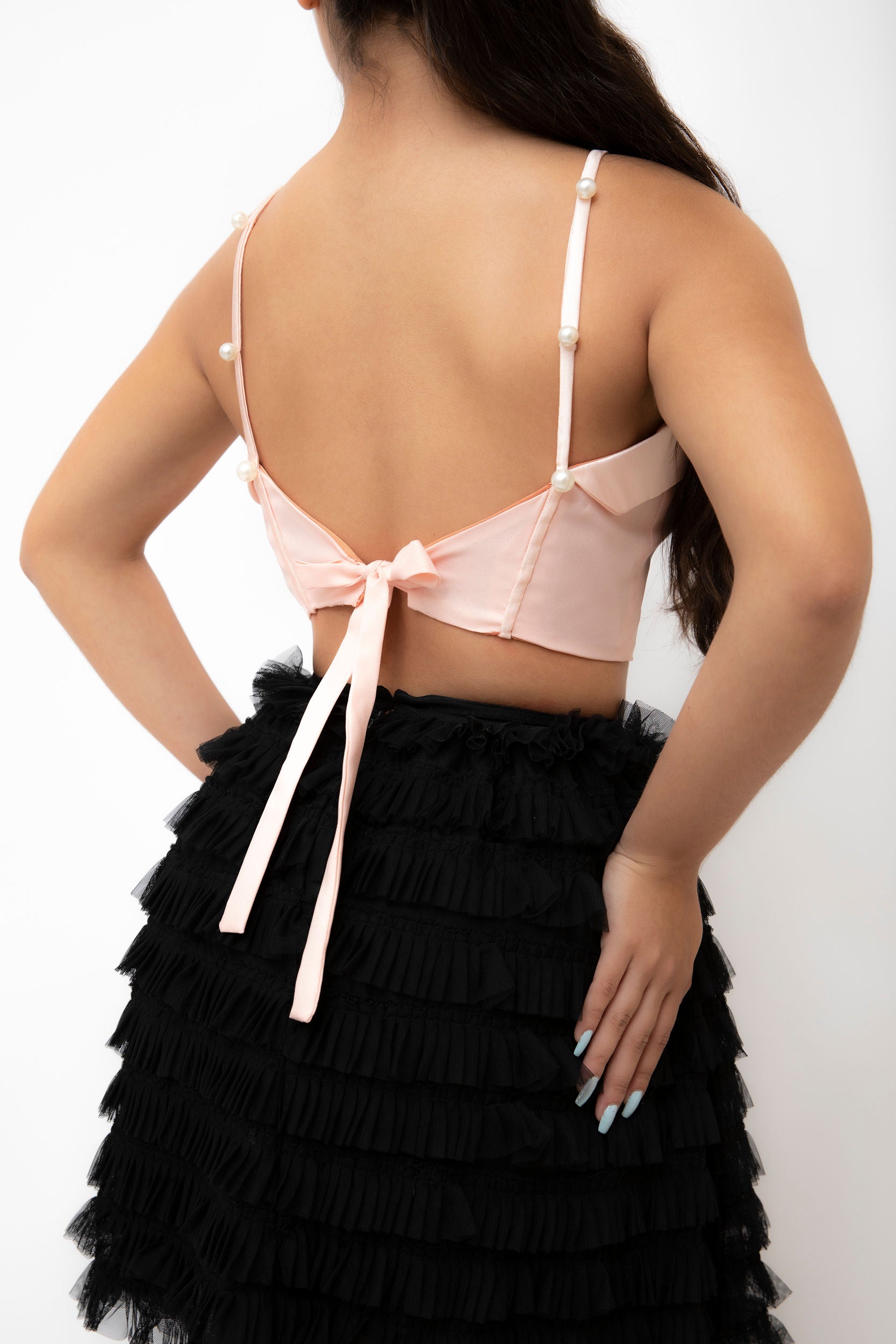 Pink bow crop top back.