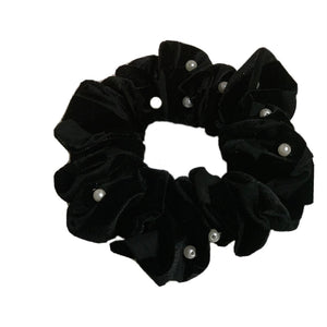 Black velvet scrunchie with pearls.