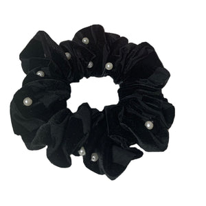 Black velvet scrunchie closeup view.